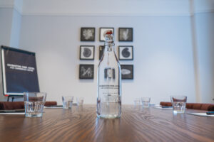 Glass Water Bottle in Meeting Room