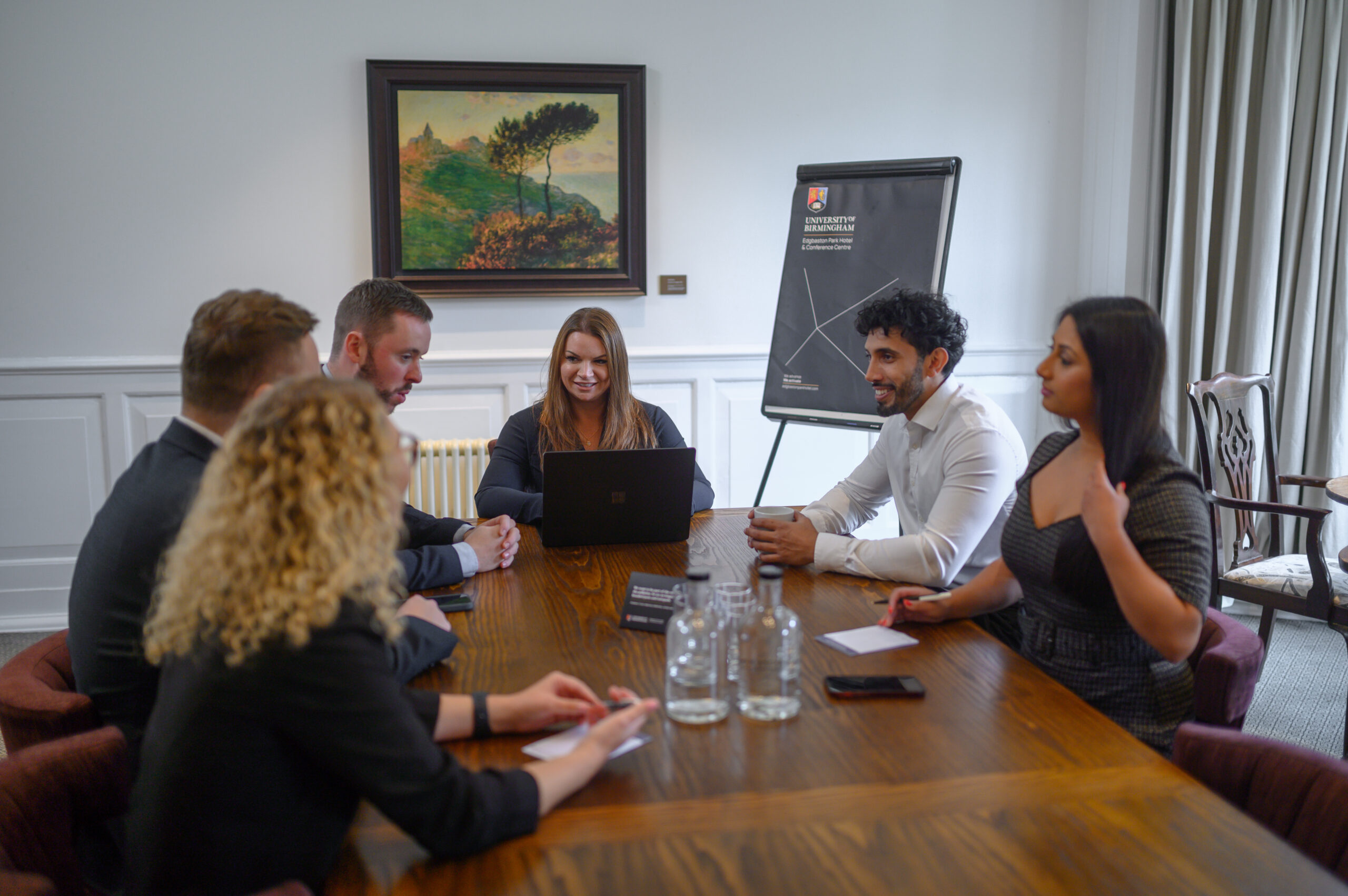 A group of people in a meeting