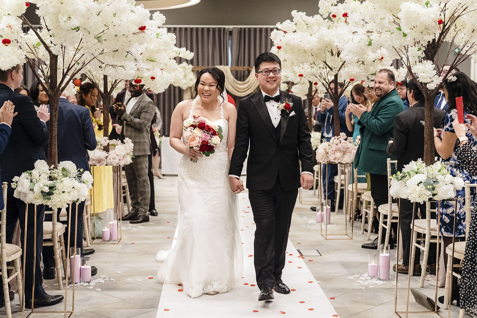A married couple walking down the aisle