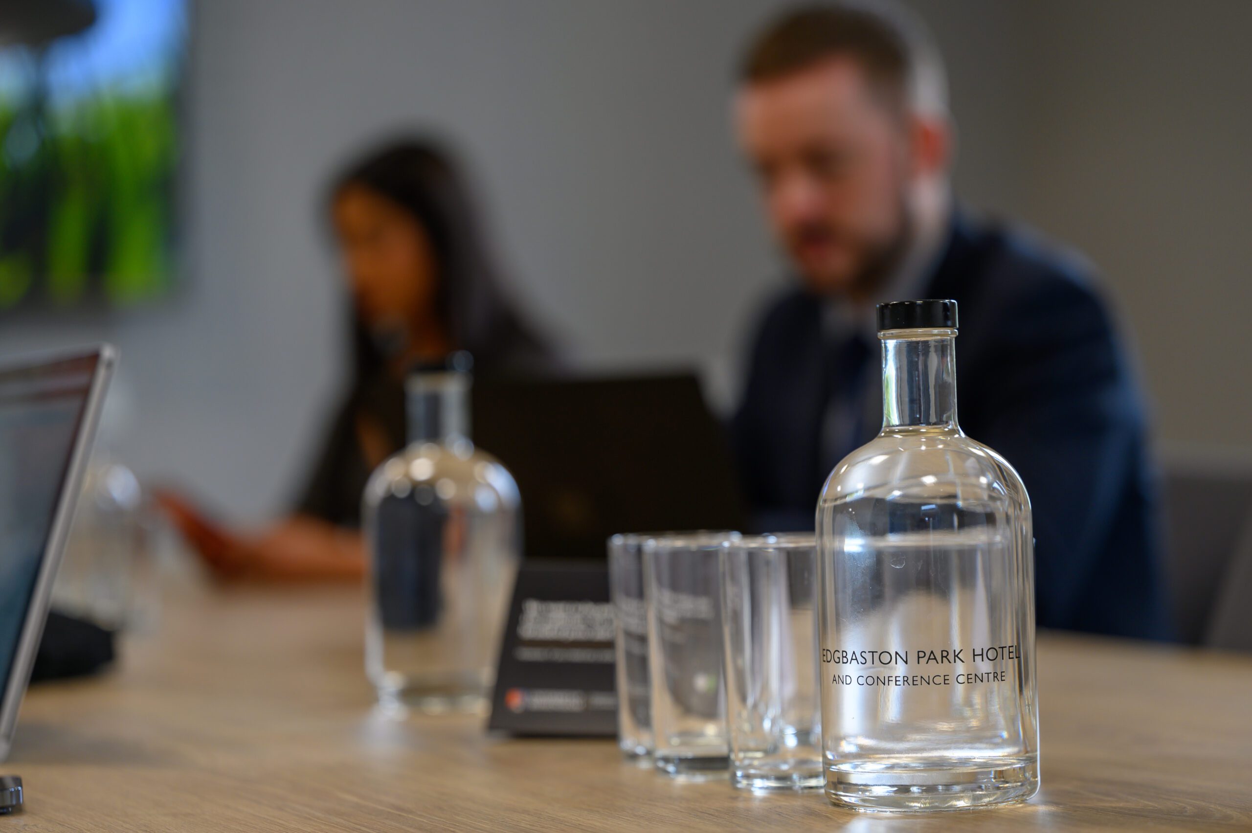 A water bottle on a table ready for a meeting