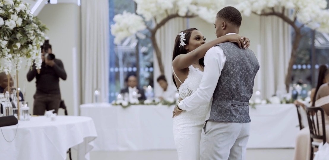 A bride and groom dancing