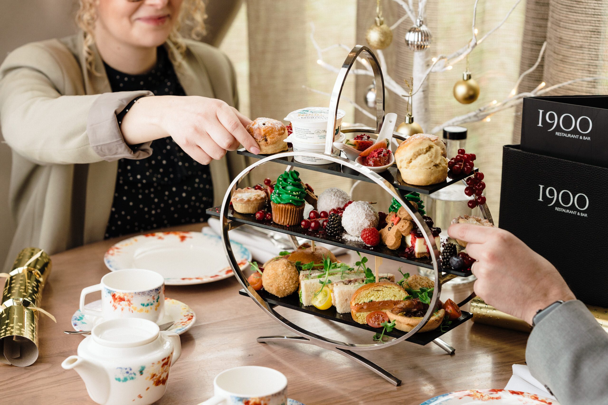 Two people picking from the afternoon tea