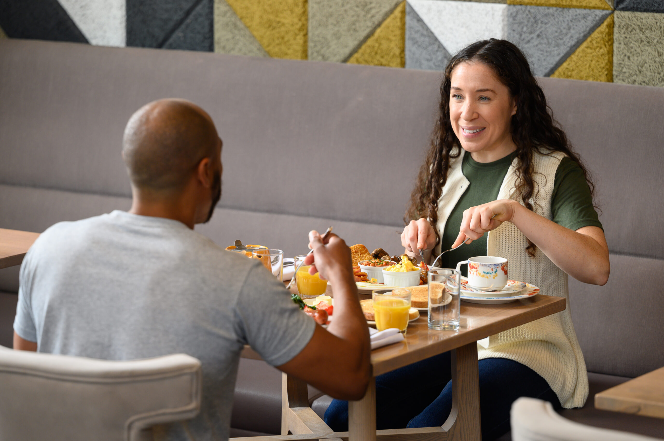 Couple eating at table in restaurant